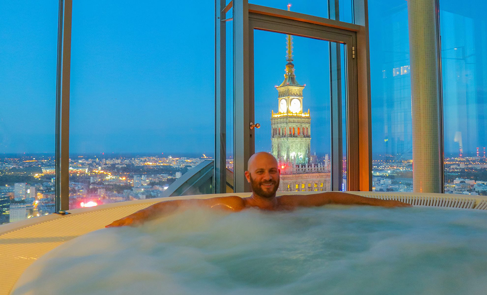 I'm in a Huge Hot Tub With an Amazing View of the Warsaw Palace of Culture at Night