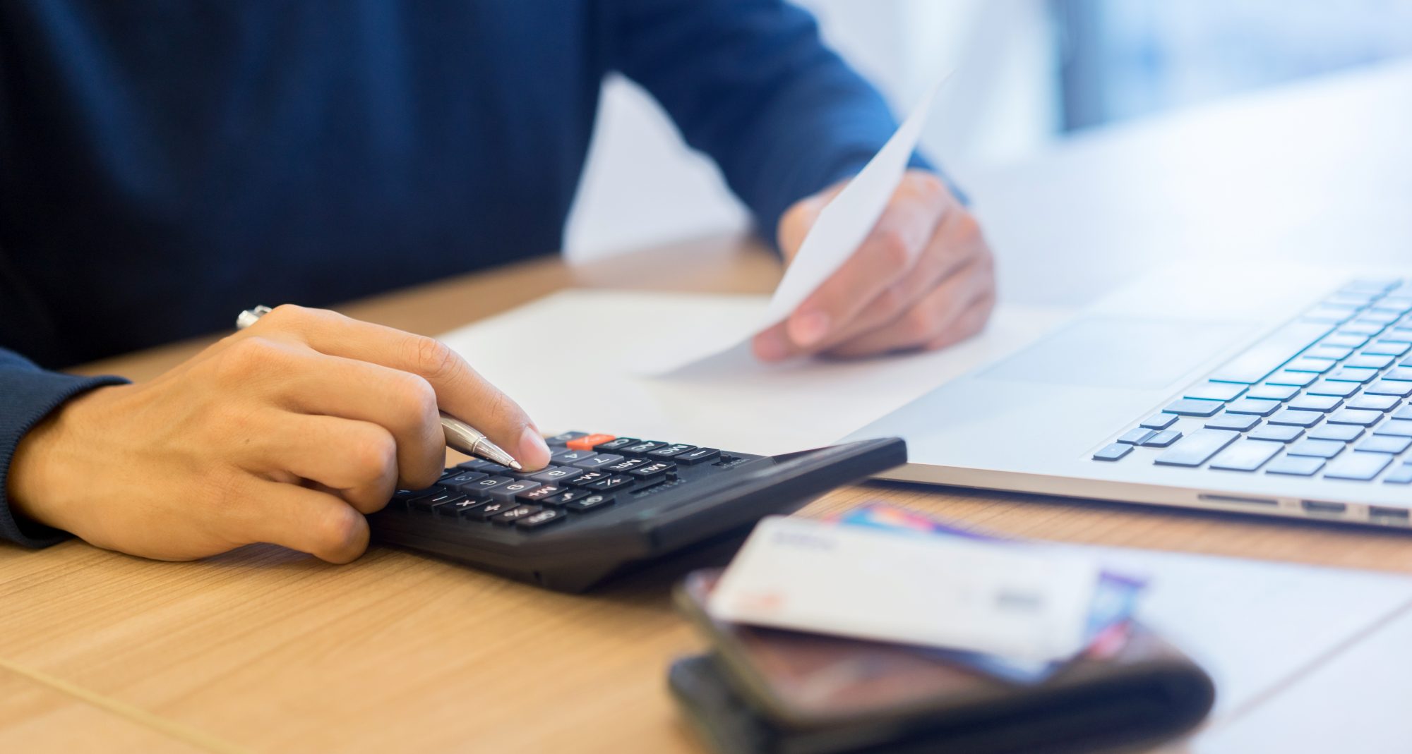 Man budgeting paperwork