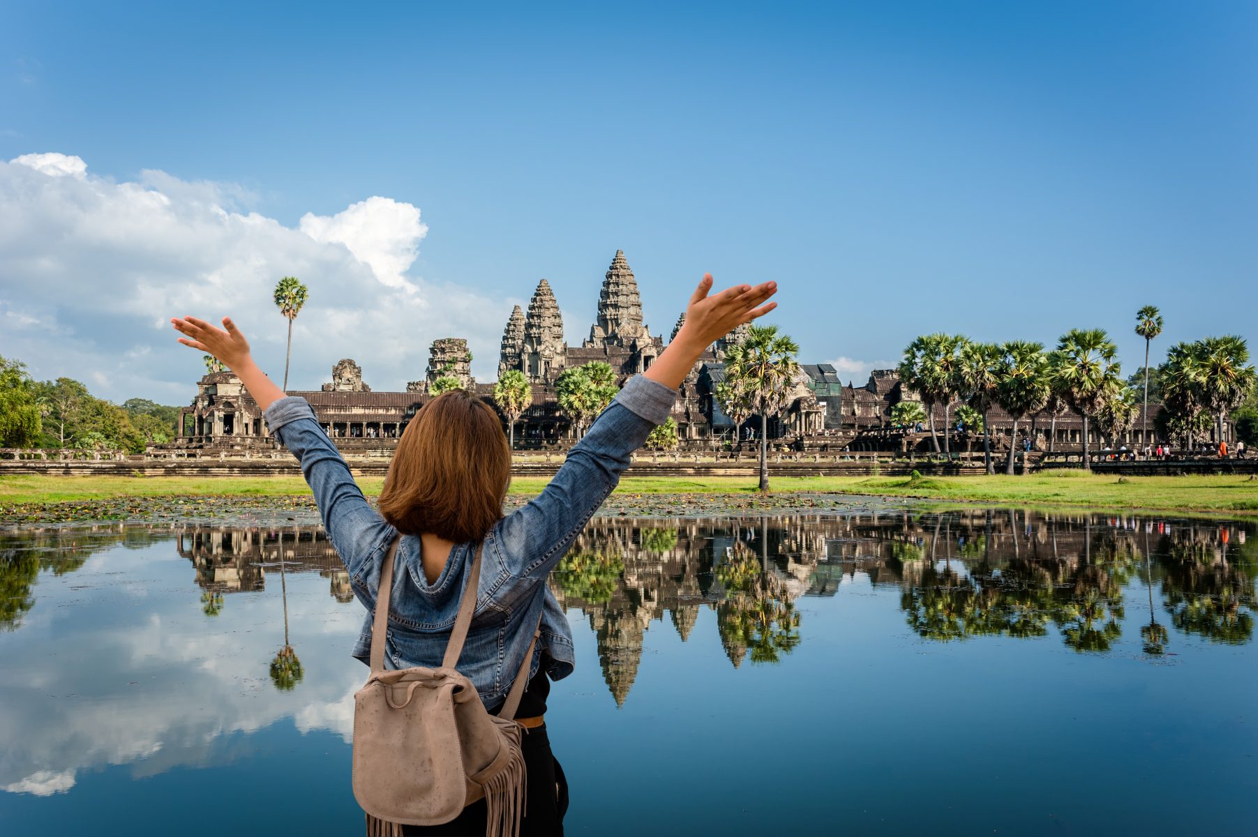 Tourist woman in front of Angkor Wat in Cambodia